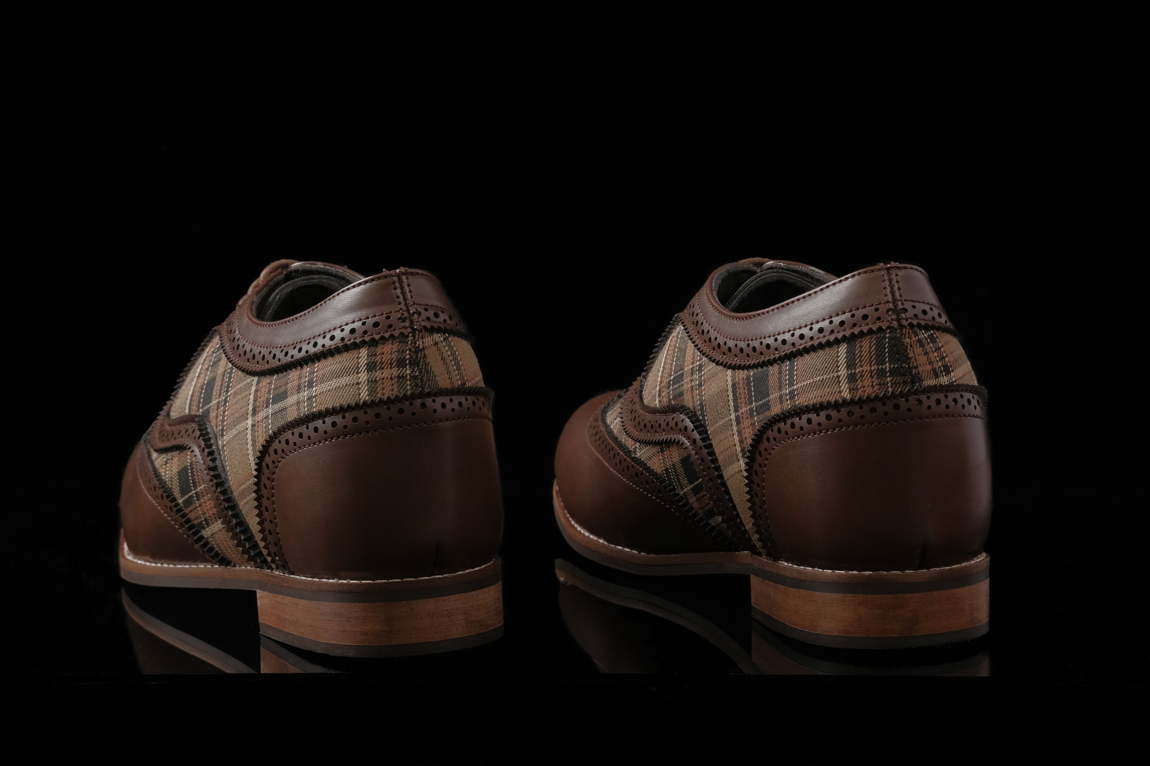Edinburgh is a designer elevator brogue crafted with a discreet 2.5 inch hidden lift, combining textured textile detailing with classic brogue construction. Designed for weddings, formal dressing, and elevated smart casual wear, the silhouette balances timeless structure with handcrafted comfort and understated height enhancement. back view