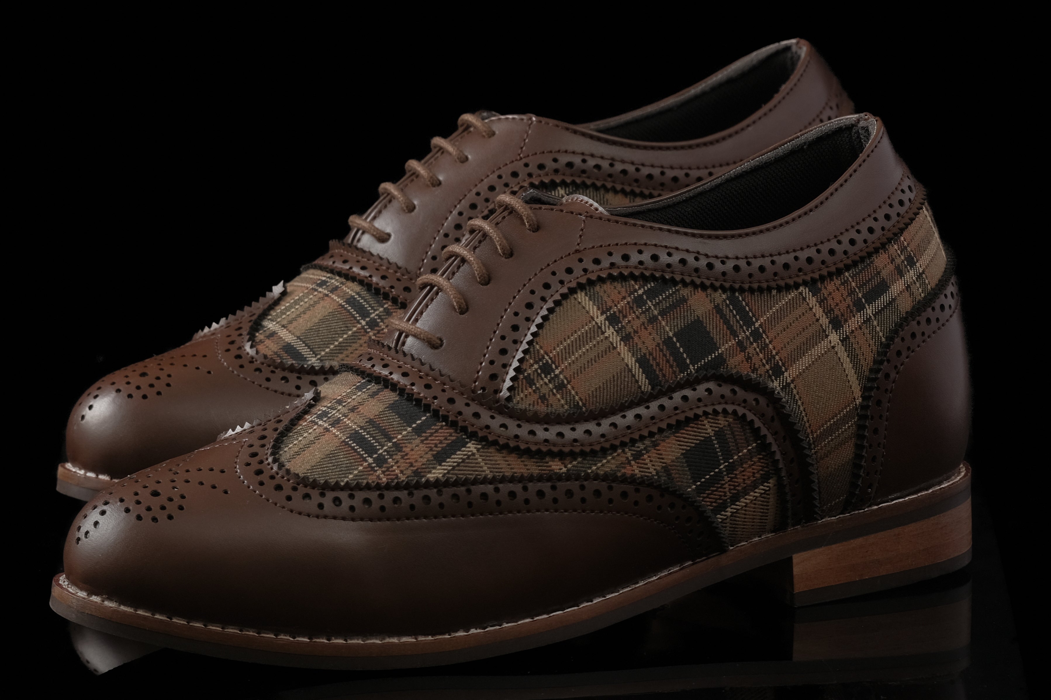 Edinburgh is a designer elevator brogue crafted with a discreet 2.5 inch hidden lift, combining textured textile detailing with classic brogue construction. Designed for weddings, formal dressing, and elevated smart casual wear, the silhouette balances timeless structure with handcrafted comfort and understated height enhancement.