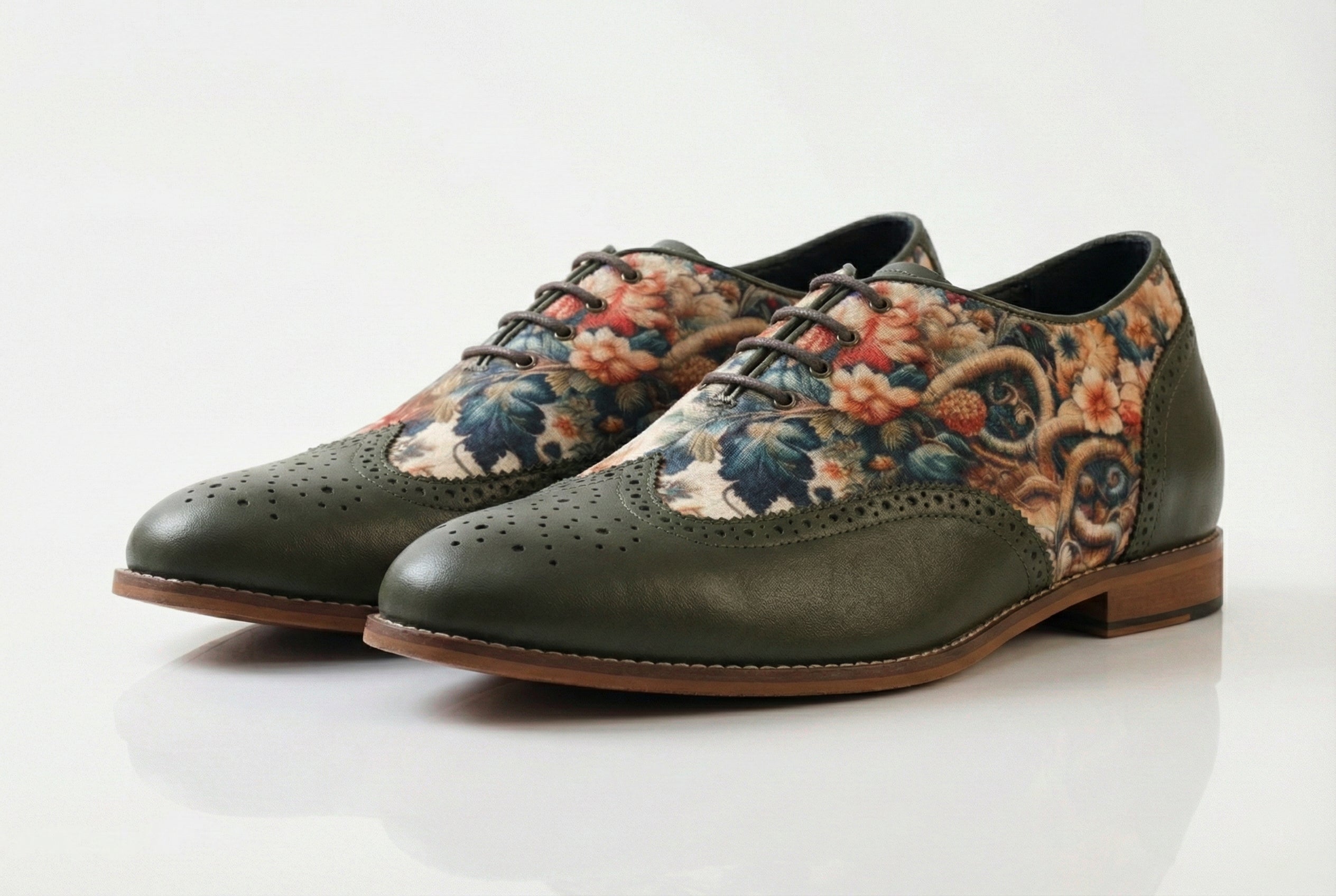 Flores is a designer elevator brogue crafted with a discreet 2.5 inch hidden lift, layered with printed floral textile panels and classic brogue construction. Designed for weddings, celebrations, statement dressing, and elevated smart casual wear, the silhouette combines handcrafted detailing with understated height enhancement and expressive texture.