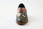 Flores is a designer elevator brogue crafted with a discreet 2.5 inch hidden lift, layered with printed floral textile panels and classic brogue construction. Designed for weddings, celebrations, statement dressing, and elevated smart casual wear, the silhouette combines handcrafted detailing with understated height enhancement and expressive texture.