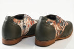 Flores is a designer elevator brogue crafted with a discreet 2.5 inch hidden lift, layered with printed floral textile panels and classic brogue construction. Designed for weddings, celebrations, statement dressing, and elevated smart casual wear, the silhouette combines handcrafted detailing with understated height enhancement and expressive texture. back view
