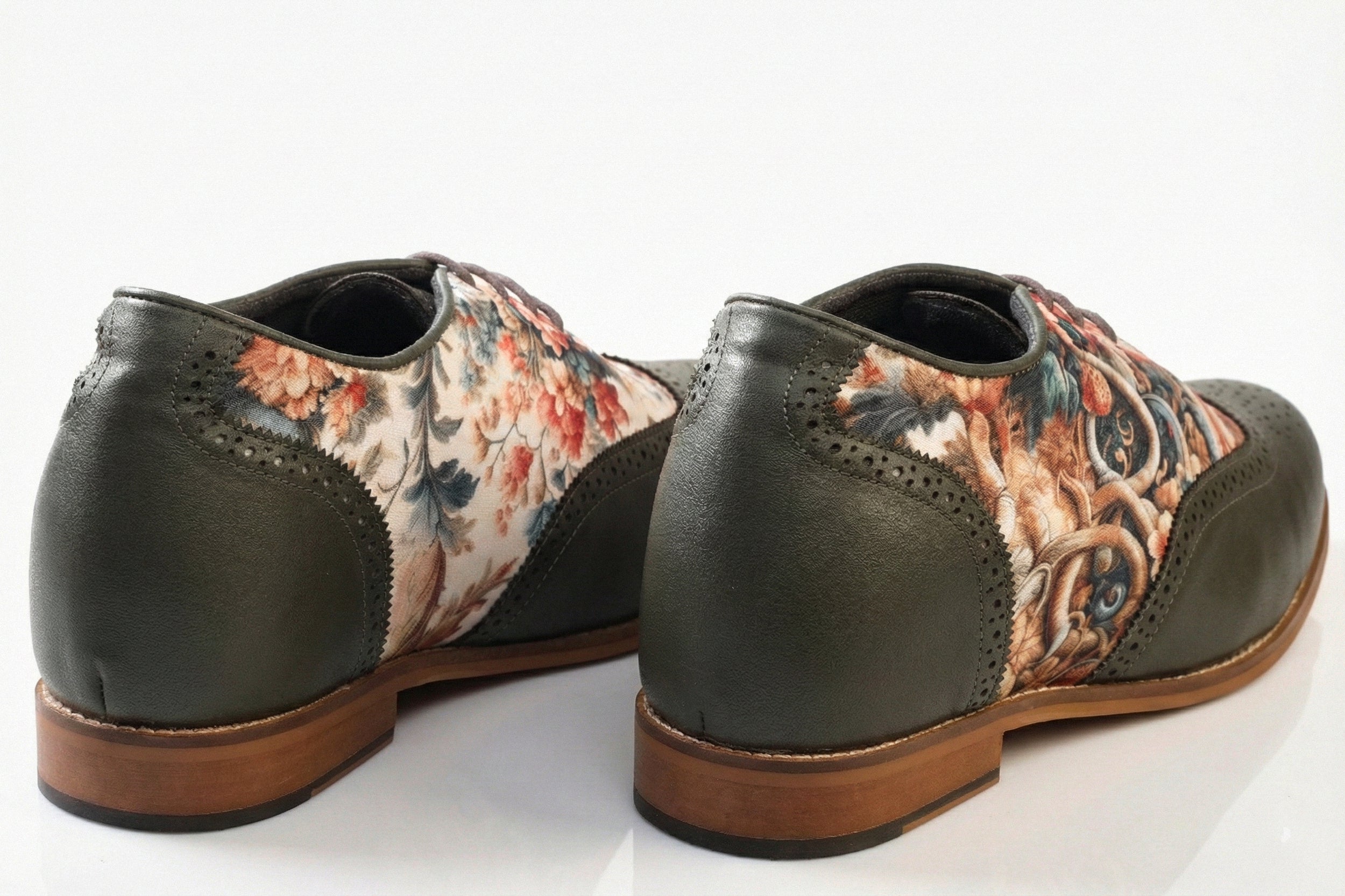 Flores is a designer elevator brogue crafted with a discreet 2.5 inch hidden lift, layered with printed floral textile panels and classic brogue construction. Designed for weddings, celebrations, statement dressing, and elevated smart casual wear, the silhouette combines handcrafted detailing with understated height enhancement and expressive texture. back view